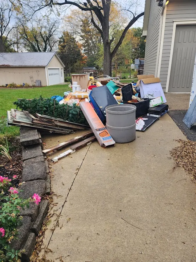 Dumpster being loaded with debris for 12 Yard Dumpster Rental in Gettysburg